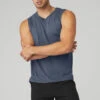The Triumph Muscle Tank - Bluestone 1 The Triumph Muscle Tank - Bluestone -Alo Fashion Store M2033R 04352 b1 s3 a1 1 m108